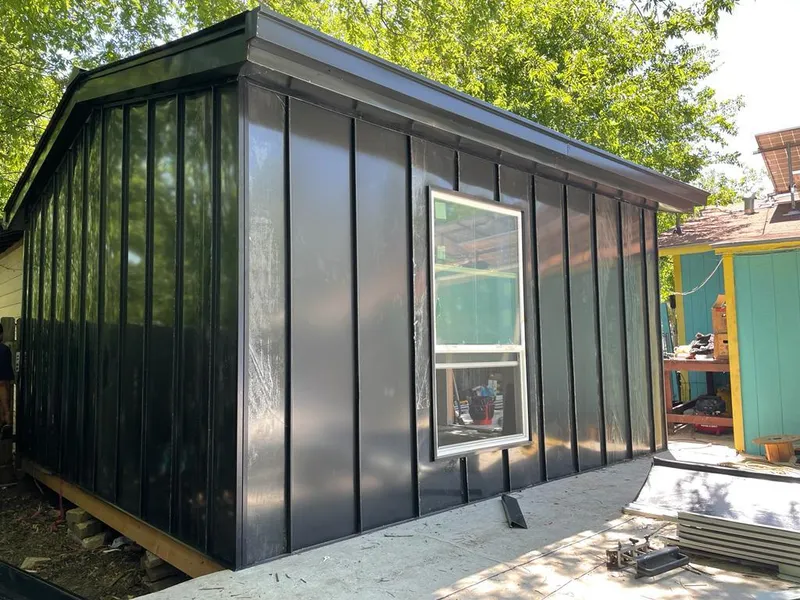 Black standing seam metal wall panels for Roof Inspection in East Hampton